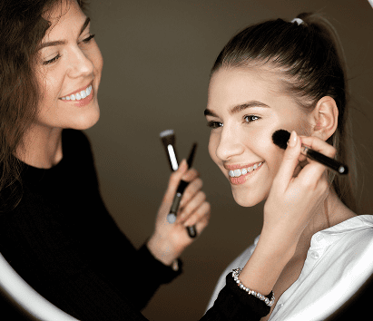 reflection in the mirror of makeup artist the char 2024 09 18 17 29 20 utc Top Hair & Nail Trends to Try This Season at Manhattan Hair & Nail Spa
